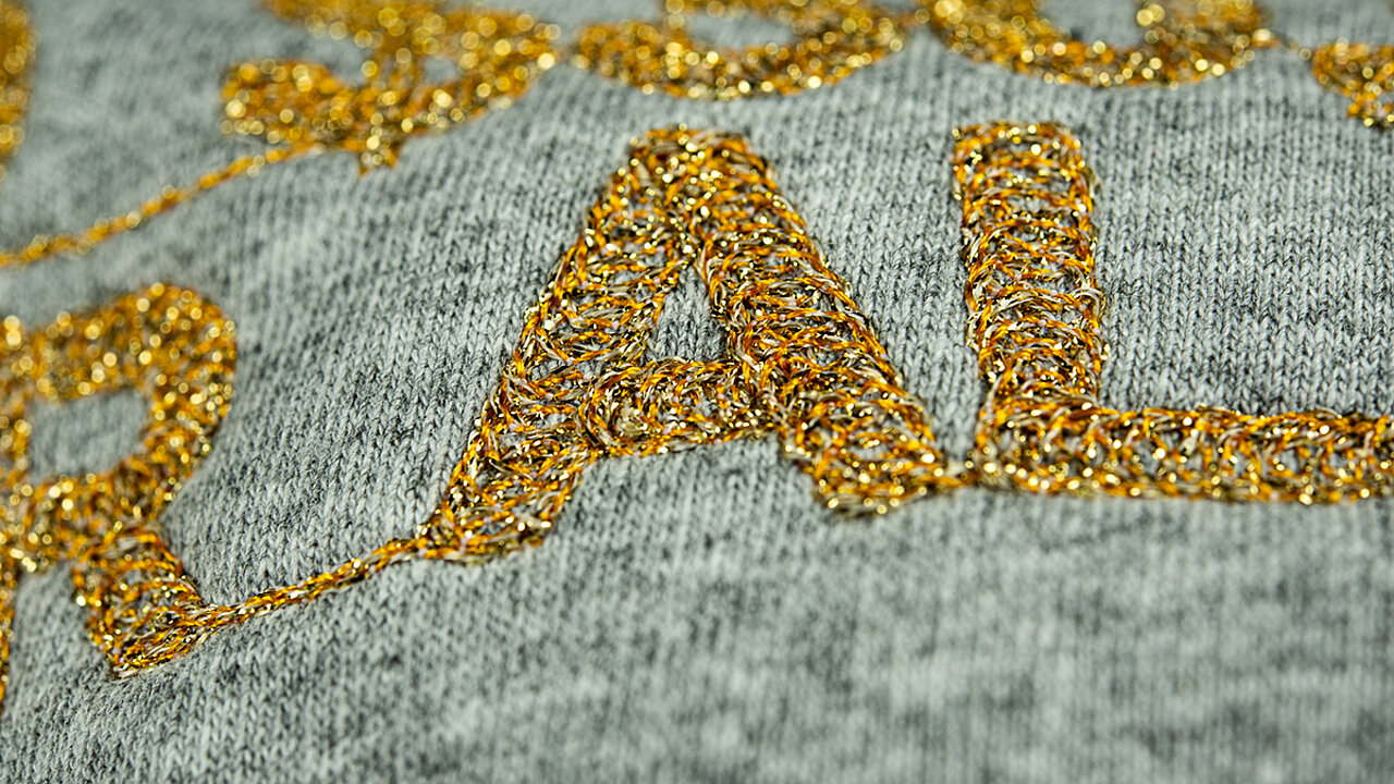 Close up of the letters RAL in gold